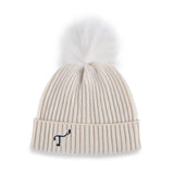 Women's white, cashmere, knitted, beanie with white faux fur pom top and navy, embroidered T3 logo.