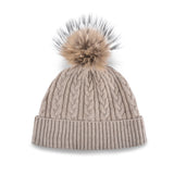 Women's beige, cashmere, knitted, beanie with light brown faux fur pom top.