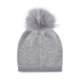 Women's cashmere, knitted, beanie in light gray with light gray faux fur pom top.