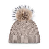 Women's beige, cotton, knitted, beanie with light brown fur pom top.