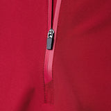 Close-up of a red zipper on a red fabric background