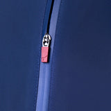Close-up of a blue zipper with a red tag featuring a logo on a matching blue background.