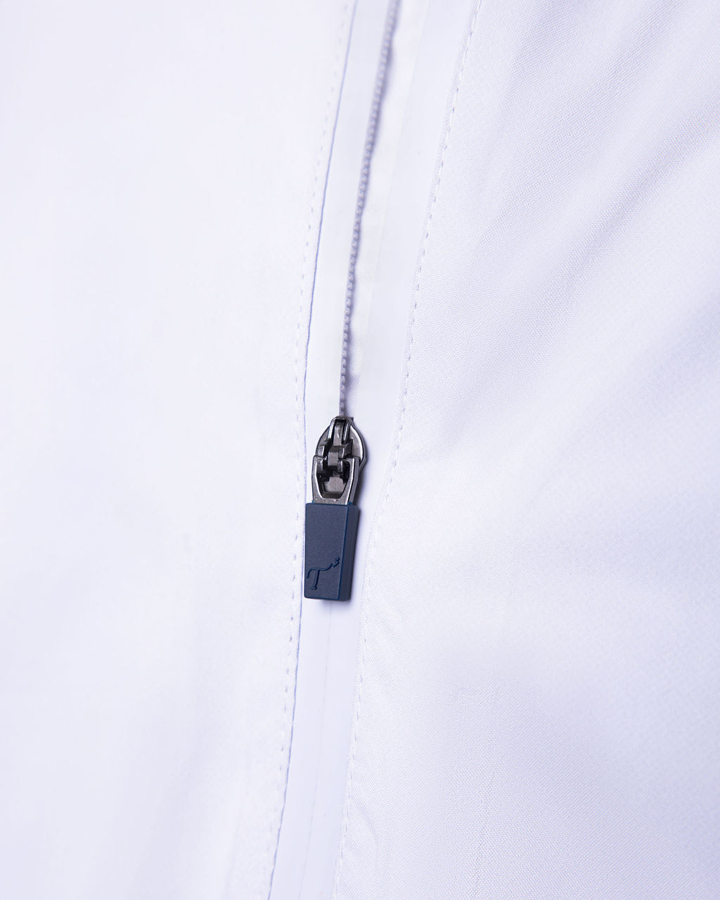 Close-up of a zipper on a white background