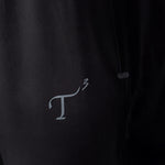 Close up of T3 logo on pant fabric