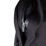 Close up of side pocket with zipper opened revealing webbed inner lining of pant