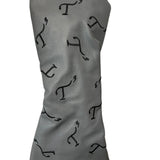 Gray leather driver head cover with black embroidered T3 logos in a randomized pattern.